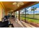 Relaxing screened-in patio features comfortable seating and views of the lush golf course at 318 Winding Brook Ln # 104, Bradenton, FL 34212