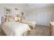 Well-lit bedroom featuring two twin beds, wood floors, and closet space at 3330 Gulf Of Mexico Dr # 205D, Longboat Key, FL 34228