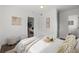 Cozy bedroom with white bedding, wood floors, and natural light at 346 Suwanee Ave, Sarasota, FL 34243