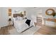 Cozy bedroom with a comfortable bed, stylish decor, and wood-style flooring at 346 Suwanee Ave, Sarasota, FL 34243