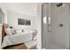 Bedroom with ensuite bathroom, wood floors, and modern fixtures at 346 Suwanee Ave, Sarasota, FL 34243