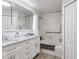 Modern bathroom with double vanity, large mirror, and bathtub at 4106 Central Sarasota Pkwy # 1013, Sarasota, FL 34238