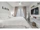 Bright bedroom with a king-size bed and modern decor at 4106 Central Sarasota Pkwy # 1013, Sarasota, FL 34238