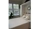 Cozy bedroom features a Murphy bed, allowing for flexible use of the space, complemented by a bright window view at 4106 Central Sarasota Pkwy # 1013, Sarasota, FL 34238