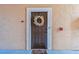 Front door with a wreath, welcome mat and keyless entry at 4106 Central Sarasota Pkwy # 1013, Sarasota, FL 34238