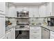Modern kitchen with stainless steel appliances and granite countertops at 4106 Central Sarasota Pkwy # 1013, Sarasota, FL 34238