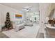 Spacious living room with sectional sofa and large window at 4106 Central Sarasota Pkwy # 1013, Sarasota, FL 34238