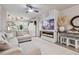 Living room with sectional sofa, fireplace, and built-in entertainment center at 4106 Central Sarasota Pkwy # 1013, Sarasota, FL 34238