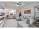 Bright living room featuring sectional sofa and fireplace at 4106 Central Sarasota Pkwy # 1013, Sarasota, FL 34238