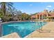 Community pool with surrounding lounge area at 4106 Central Sarasota Pkwy # 1013, Sarasota, FL 34238