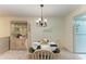 Bright dining area with round table and four chairs at 4137 Heron Way # 204E, Bradenton, FL 34205