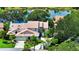 An aerial view showcasing the property nestled among lush landscaping at 4304 Camino Madera, Sarasota, FL 34238