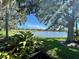 Lush landscaping and trees frame serene golf course and lake views at 4304 Camino Madera, Sarasota, FL 34238