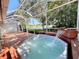 Private hot tub on a screened patio overlooking tranquil water views at 4304 Camino Madera, Sarasota, FL 34238