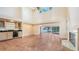 Spacious living room with high ceilings, fireplace, wet bar, and tile floors at 4304 Camino Madera, Sarasota, FL 34238