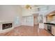 Living room featuring a fireplace, built-in wet bar, and a staircase leading to a loft at 4304 Camino Madera, Sarasota, FL 34238