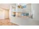 Open living room with vaulted ceilings, a fireplace, and views of the backyard at 4304 Camino Madera, Sarasota, FL 34238