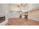 Living room with high ceilings, a fireplace, a loft area, and tile flooring at 4304 Camino Madera, Sarasota, FL 34238