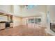 Open living space with a wet bar, fireplace, and views of the outdoor patio area at 4304 Camino Madera, Sarasota, FL 34238