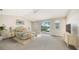Spacious main bedroom with vaulted ceiling, plush carpet, and water view at 4304 Camino Madera, Sarasota, FL 34238