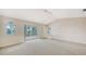 Spacious main bedroom with vaulted ceiling, sliding glass doors to patio at 4304 Camino Madera, Sarasota, FL 34238