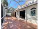 Spacious screened patio with a hot tub, tile flooring, and access to the home's interior at 4304 Camino Madera, Sarasota, FL 34238
