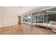 Bright sunroom with sliding glass doors leading to a patio with a hot tub at 4304 Camino Madera, Sarasota, FL 34238
