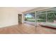 Sunroom with tile floors, sliding glass doors, and a hot tub overlooking the golf course at 4304 Camino Madera, Sarasota, FL 34238