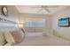 King size bed, dresser and flat screen TV at 4621 Gulf Of Mexico Dr # 16B, Longboat Key, FL 34228