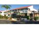 Attractive building exterior with lush landscaping and inviting entryway at 4621 Gulf Of Mexico Dr # 16B, Longboat Key, FL 34228