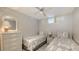 Bright guest bedroom with twin beds and wicker furniture at 4621 Gulf Of Mexico Dr # 16B, Longboat Key, FL 34228