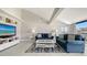 Spacious living room with comfortable seating and large TV at 4621 Gulf Of Mexico Dr # 16B, Longboat Key, FL 34228