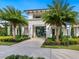 Community clubhouse entrance with a well-manicured garden and ample parking at 4925 Surfside Cir, Bradenton, FL 34211