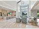 Spacious clubhouse with a large kitchen, living area, and floor-to-ceiling windows overlooking the pool at 4925 Surfside Cir, Bradenton, FL 34211