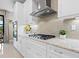 Kitchen featuring stainless steel appliances, a gas cooktop, and granite countertops at 4925 Surfside Cir, Bradenton, FL 34211