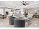 Open-concept living room seamlessly connects to the kitchen and dining areas for easy entertaining at 4925 Surfside Cir, Bradenton, FL 34211