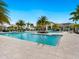 Large outdoor swimming pool surrounded by lush landscaping and comfortable lounge seating at 4925 Surfside Cir, Bradenton, FL 34211