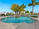Enjoy the beautiful community pool with ample seating and mature trees in this desirable neighborhood at 4925 Surfside Cir, Bradenton, FL 34211