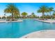 Inviting outdoor pool area surrounded by lush landscaping and comfortable lounge seating at 4925 Surfside Cir, Bradenton, FL 34211