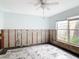 Bedroom under renovation with marble tile floor, exposed walls, and a window view at 5055 N Beach Rd # 106, Englewood, FL 34223