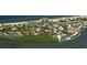 Aerial view showing community location near water, beach, and other buildings at 549 Sutton Pl, Longboat Key, FL 34228