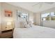 Bright bedroom with a comfortable queen-size bed and plenty of natural light at 549 Sutton Pl, Longboat Key, FL 34228