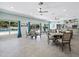 Community dining room with large windows and pool view at 549 Sutton Pl # T19, Longboat Key, FL 34228