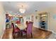 Bright dining room with hardwood floors and chandelier at 60 Gulf Blvd # 402, Indian Rocks Beach, FL 33785