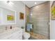 Updated bathroom featuring a glass shower, pebble floor, and a marble vanity at 609 Colonial Bay Dr, Nokomis, FL 34275