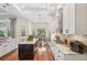 Bright, open kitchen featuring a center island, modern appliances, and a view of the dining area at 609 Colonial Bay Dr, Nokomis, FL 34275