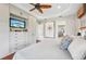 Spacious main bedroom featuring an entertainment center with tv, closet and ensuite bathroom at 609 Colonial Bay Dr, Nokomis, FL 34275
