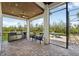 Outdoor patio with built-in grill and outdoor seating area with beautiful waterfront view at 609 Colonial Bay Dr, Nokomis, FL 34275