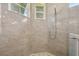 Detailed view of the beautifully tiled shower featuring modern fixtures at 609 Colonial Bay Dr, Nokomis, FL 34275