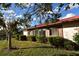 Well-maintained exterior with landscaped grounds and water views at 6564 Draw Ln # 102, Sarasota, FL 34238